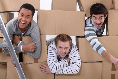 Moving team handling flat removals in Kenley outside an apartment building
