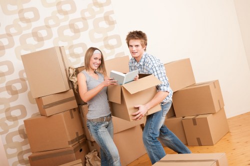 Professional movers handling furniture during a small removal in Kenley
